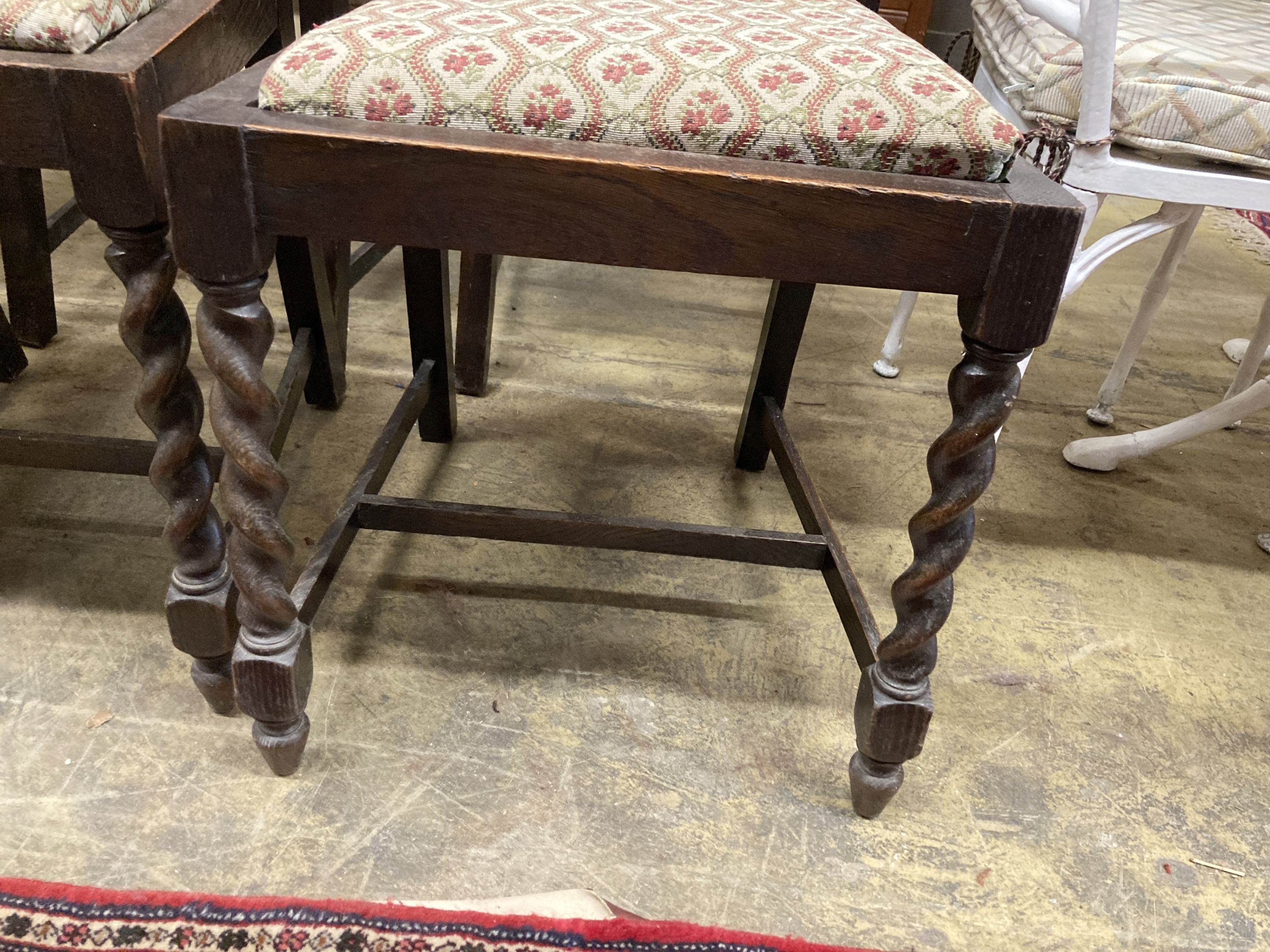 A set of six 1920's oak barleytwist dining chairs, two with arms